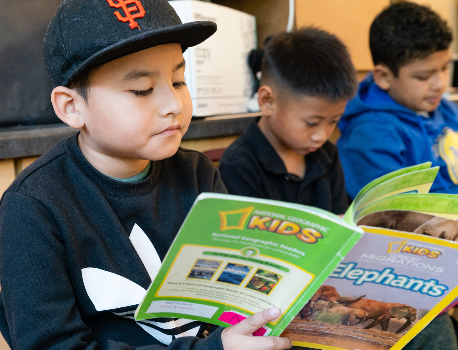 Children reading together in a classroom